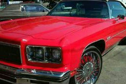 red car exterior buffing and polishing service.